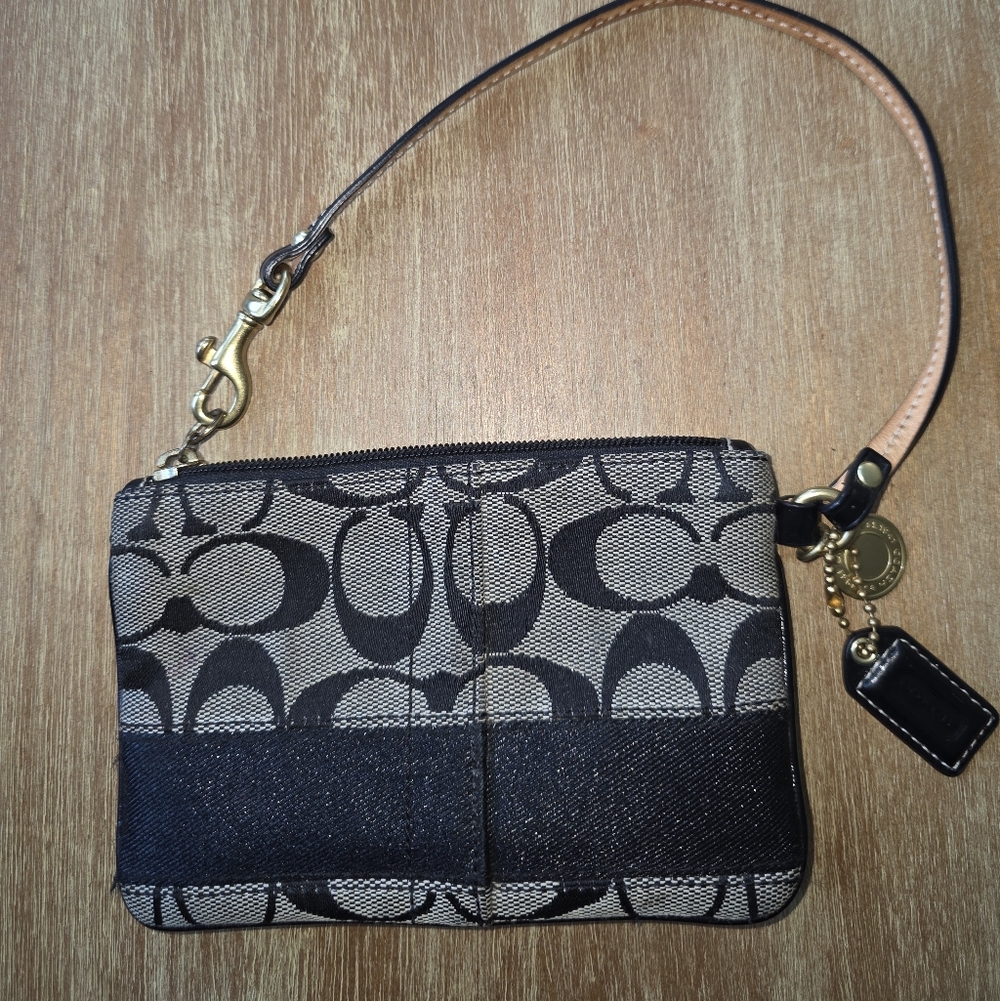 Coach Signature Black Wristlet With Leather Strap With brass Hardware.